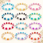 Dual shade sparkle and lustre glass bracelets with white pearl accents, 12-piece 8mm stretchable set