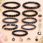 Black glass bracelets with multicolour charms, 9-piece stretchable set